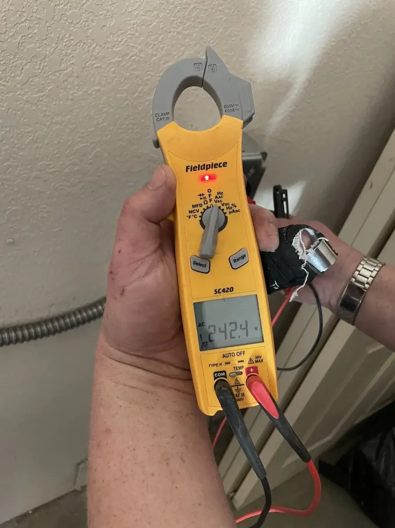 Voltage testing with clamp meter during Electrical Installation Services in Lauderdale-by-the-Sea